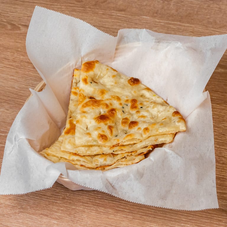 Savor our freshly baked naan